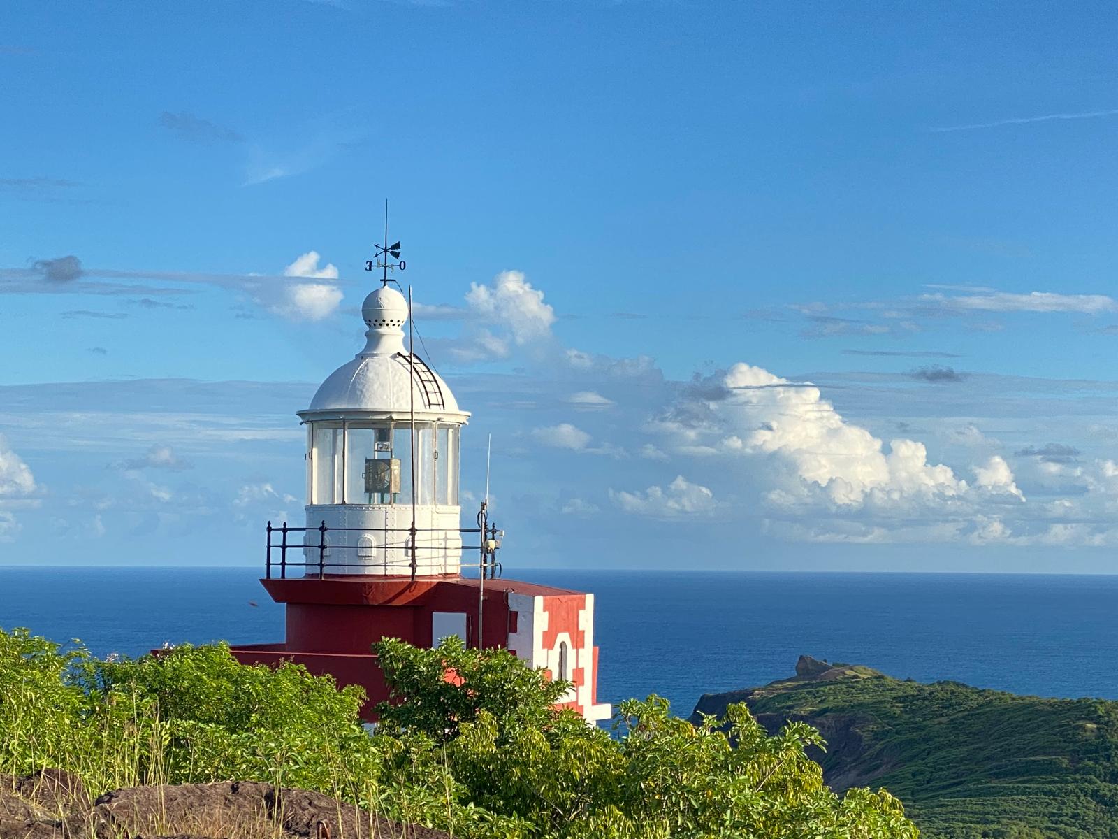 The red-and-white Caravelle lighthouse above the Atlantic, Caravelle peninsula, Martinique